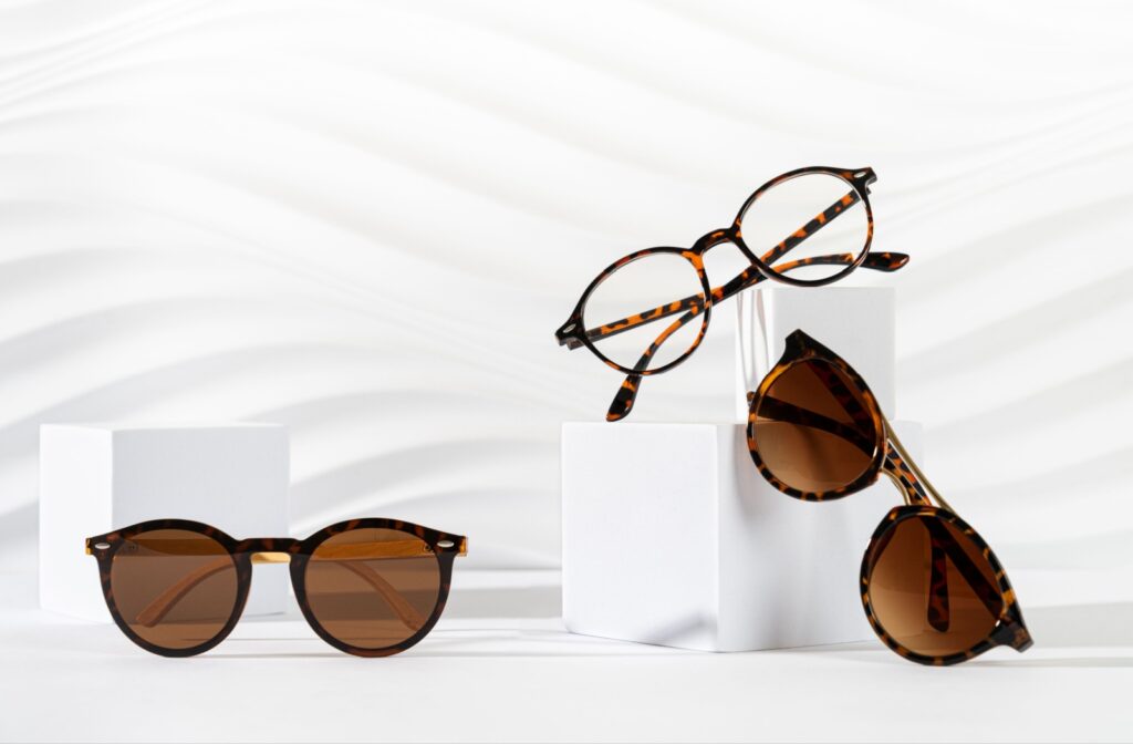 Three pairs of glasses sitting on white blocks to showcase them